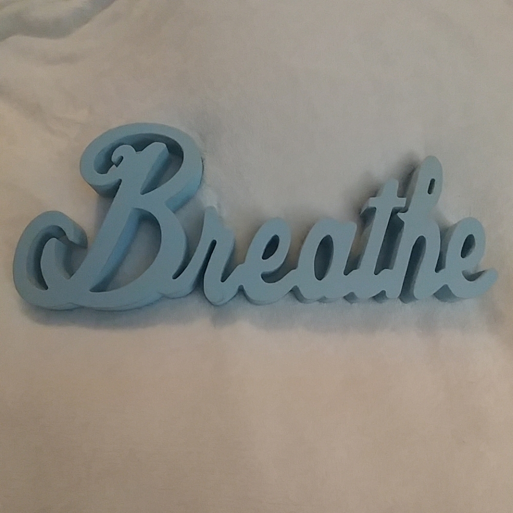 Wooden sign "Breathe"
